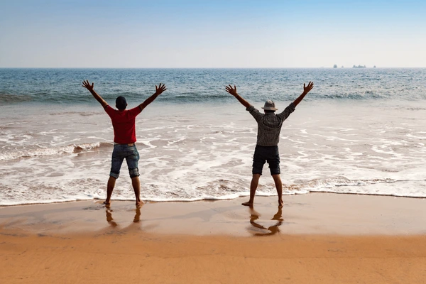 happy-tourist-relaxing-on-chandrabhaga-beach-600nw-1080777911