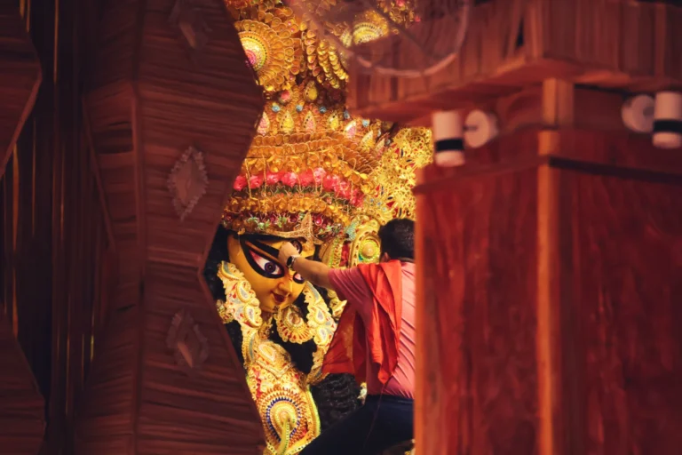 Illuminated Durga Puja pandal with Chandannagar lighting and traditional idol in Kolkata