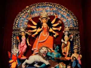 Goddess Durga slaying Mahishasura demon idol with lion at Bagbazar Sarbojanin pandal