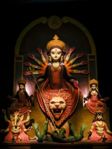 Maa Durga idol with ten hands holding weapons during Kolkata Durga Puja celebration